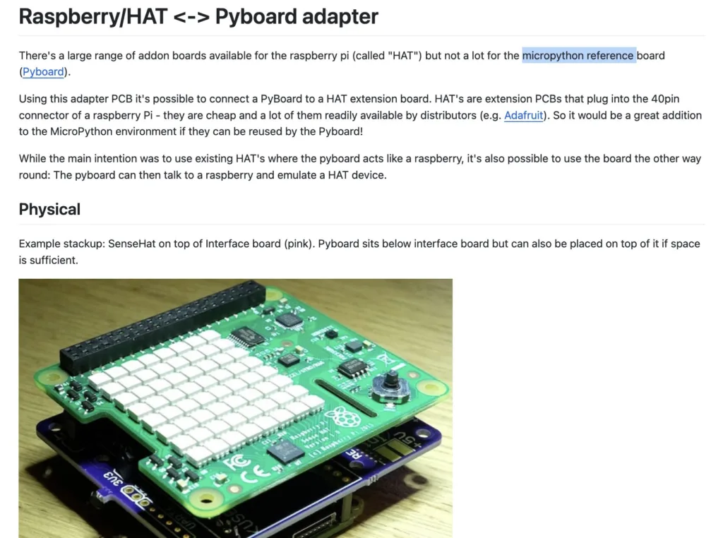 Close-up of a Raspberry Pi board with a stacked HAT/PyBoard adapter (green PCB with many white header blocks) and a purple adapter underneath