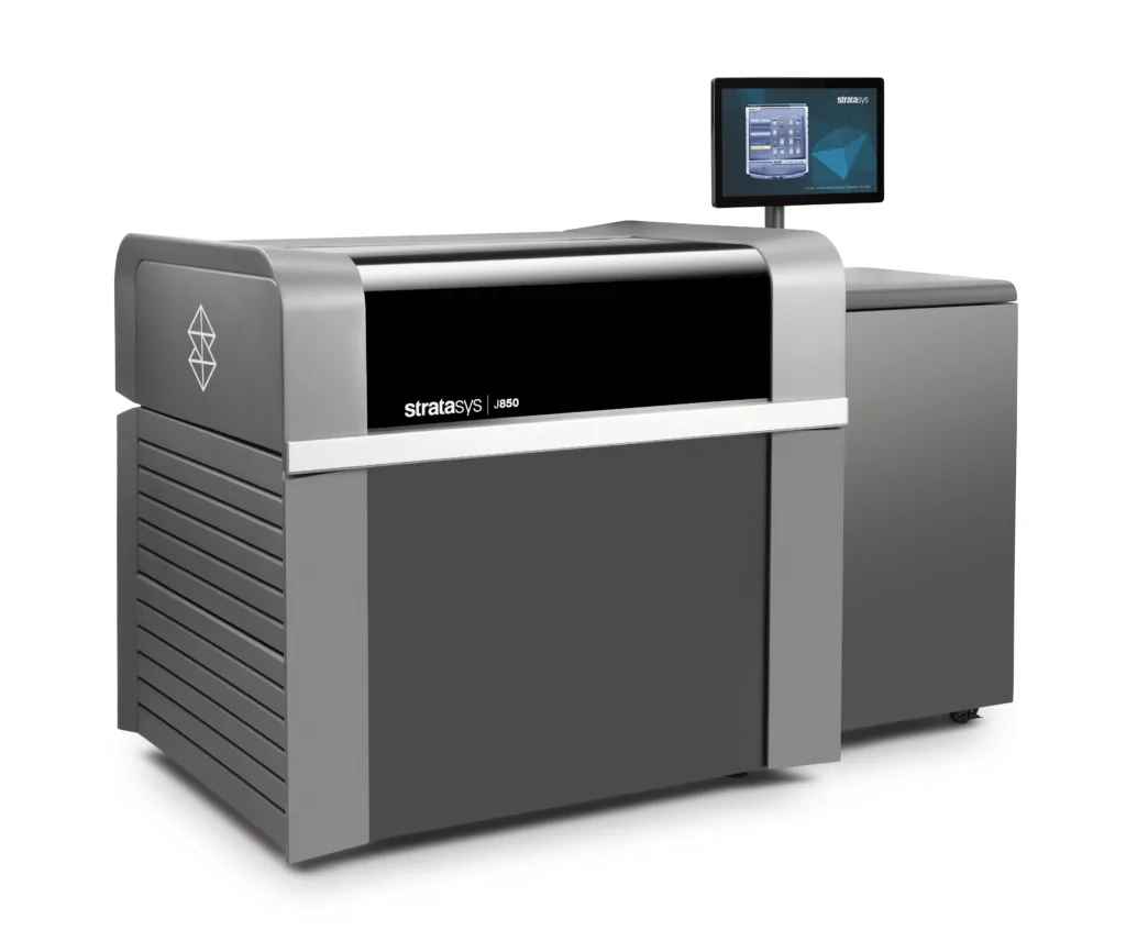 Industrial Stratasys J850 3D printer with black front panel and attached monitor on top side.