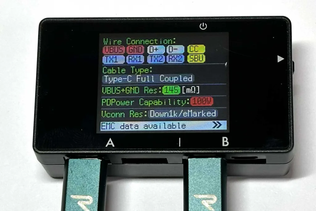 Handheld power meter display with two blue-green USB-C cables plugged in, showing connection settings and specs at a glance.