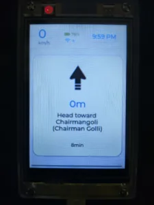 Navigation screen with a large upward arrow and the instruction to head toward Chamangoli (Chairman Golli); time 9:59 PM, 0 m distance, 0 km/h (battery 76%).