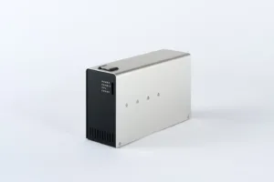 Metal rectangular power/compute unit with a black front panel labeled POWER ENABLE CPU ERROR and bottom ventilation slots on a white surface.