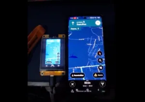 Two smartphones side by side displaying a navigation app with a blue map and route lines, showing turn-by-turn controls at the bottom.