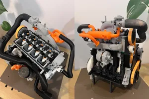 Split view of two LEGO engine-like machines with orange pipes, gears, and black hoses on dark bases.