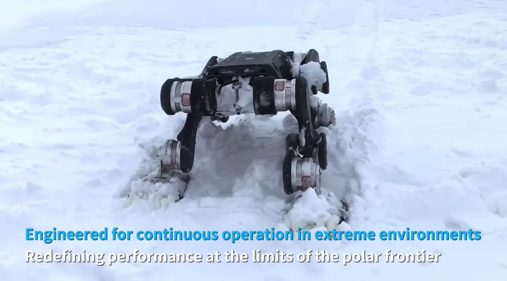 Six-wheeled rugged robotic rover working in deep snow, climbing a snow mound in an extreme environment.