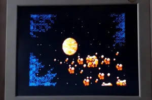 Pixel art space scene with a large orange sun, blue star clusters, and orange rocks on a dark background, shown on a monitor edge window.