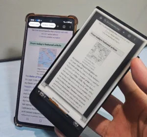 Two smartphones held side by side showing Wikipedia article pages on their screens, one with a map image and green header reading 'From today's featured article'.