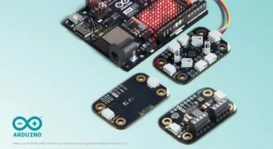 Arduino hardware kit with multiple boards and sensor modules on a light blue background, ready for prototyping.