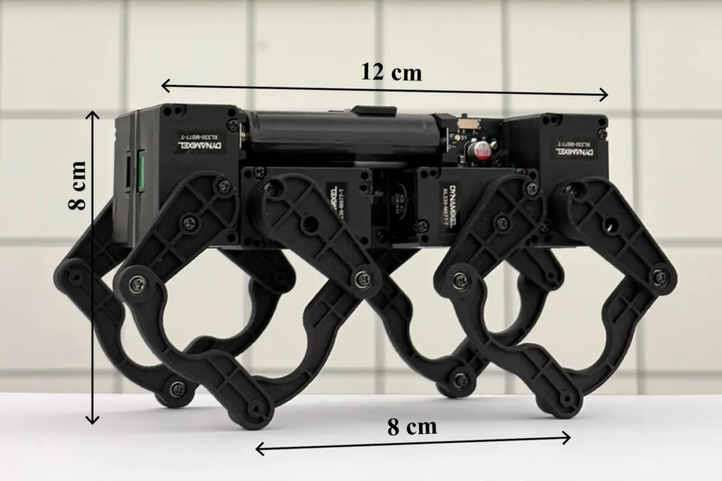 Quadruped robot with four jointed legs; overall length 12 cm, width 8 cm, height 8 cm.