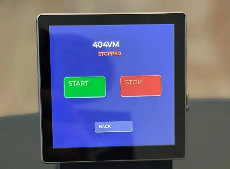 Screen showing 404VM STOPPED with a green Start button and a red Stop button, plus a Back option below.