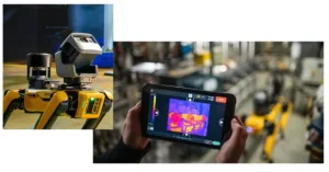 Industrial robot with a yellow body and sensor on a track, while a person holds a tablet showing a thermal image of factory equipment in the background.